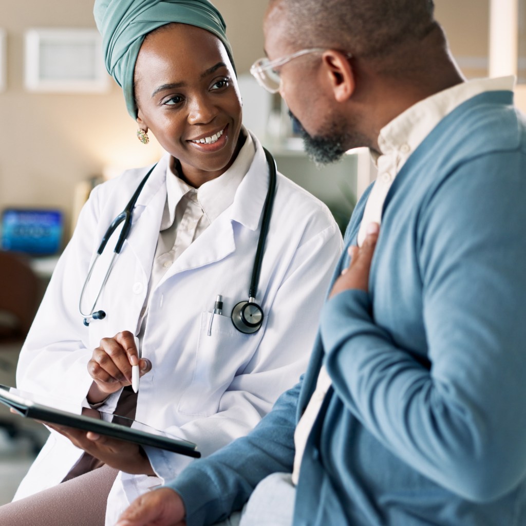 Tablet, patient and consultation with happy doctor for healthcare or chest exam results. African people, technology and medical professional explain treatment for lung wellness and help in hospital
